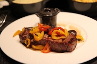  MGM Skylofts room service: 12 oz Prime New York strip with peppers, cippollini onions, and bordelaise sauce