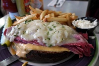  Open-faced Reuben sandwich (Corned beef and Swiss cheese with sauerkraut and Russian dressing on pumpernickel with French fried potatoes) at Lindy's, Midtown Manhattan