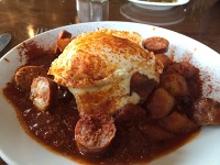  Patatas Bravas with Chorizo and Fried Egg at Rioja