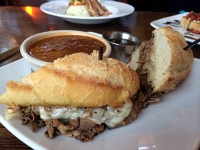  French Dip Sandwich (thinly sliced prime rib, Swiss and provolone, on a baguette with au jus) and red pepper and beef soup at the Rustic Oven, Fort Collins, CO
