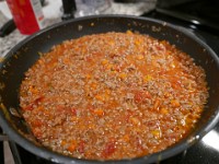 P1020998  Break apart tomatoes, and cook for a few hours.