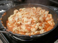 P1030035  Spaghetti and tortellini coated in sauce